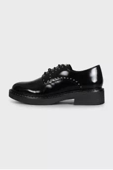 Black leather derby shoes with gold trim