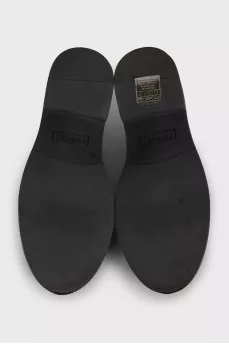 Black leather derby shoes with gold trim