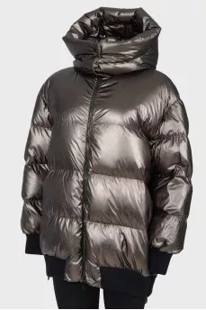 Short green down jacket with a tag