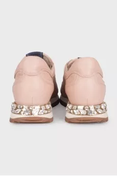 Pink leather sneakers decorated with crystals
