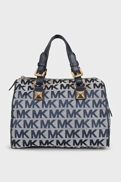 A textile bag with a signature print and handles