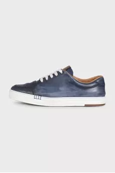 Men's dark blue sneakers feature perforations on the toe