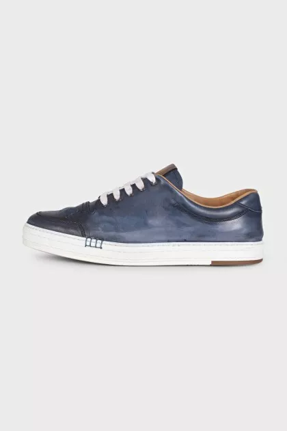 Men's dark blue sneakers feature perforations on the toe