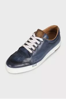 Men's dark blue sneakers feature perforations on the toe