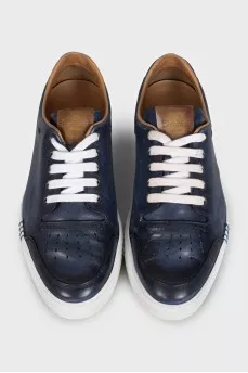 Men's dark blue sneakers feature perforations on the toe