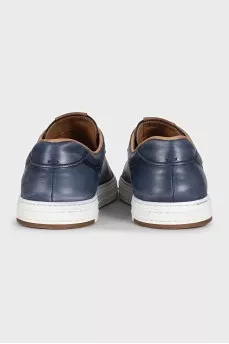 Men's dark blue sneakers feature perforations on the toe