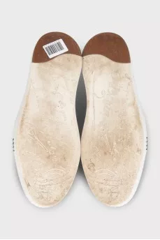 Men's dark blue sneakers feature perforations on the toe