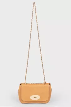 Brown leather bag on a swivel fastener