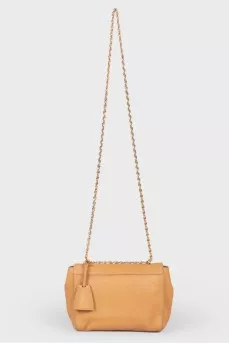 Brown leather bag on a swivel fastener