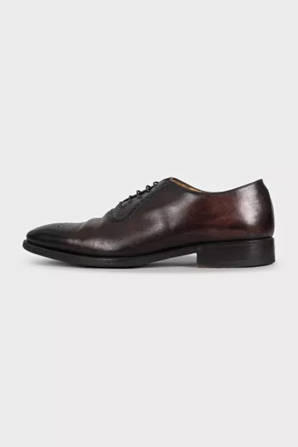 Men's brown leather shoes with perforated toes