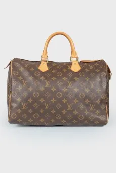 Коричневая кожаная сумка Speedy с фирменной расцветкой бренда