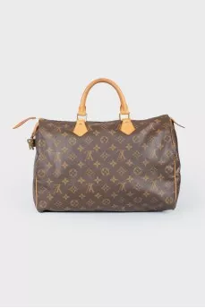 Коричневая кожаная сумка Speedy с фирменной расцветкой бренда