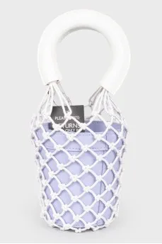 A purple bag with a net and white handles, there is a tag