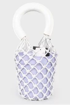 A purple bag with a net and white handles, there is a tag
