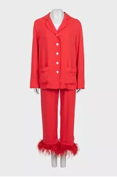 A suit with trousers decorated with feathers