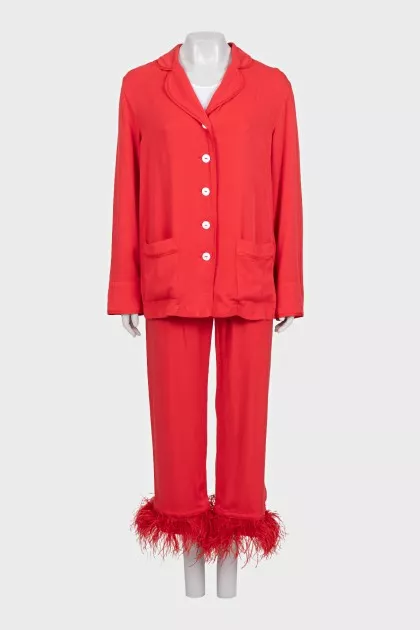 A suit with trousers decorated with feathers