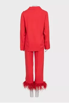 A suit with trousers decorated with feathers