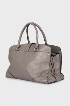 Gray leather tote bag with brand logo