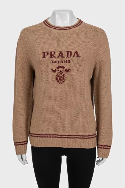 Brown straight-cut sweater with a brand logo