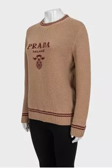 Brown straight-cut sweater with a brand logo
