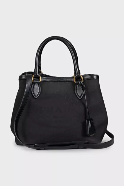 Black textile bag with a signature print
