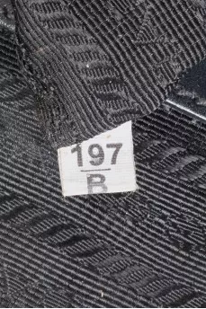 Black textile bag with a signature print
