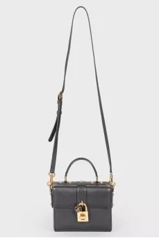 Black leather rectangular bag with a golden lock