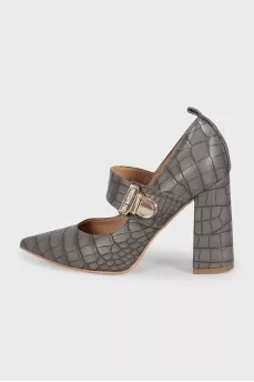 Leather shoes decorated with embossing with a bridge