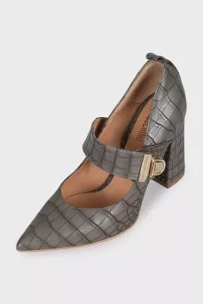 Leather shoes decorated with embossing with a bridge