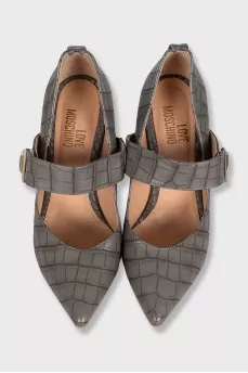 Leather shoes decorated with embossing with a bridge
