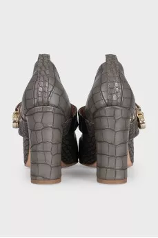 Leather shoes decorated with embossing with a bridge