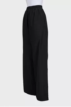 Black wide-leg trousers with elastic waistband and tag