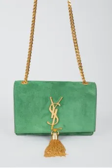 Green sued handbag with golden fittings, on the button