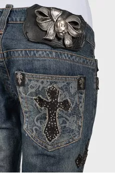 Blue jeans with embellishments on the mid-rise
