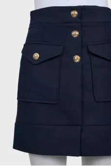 Приталена синя спідниця із карманами