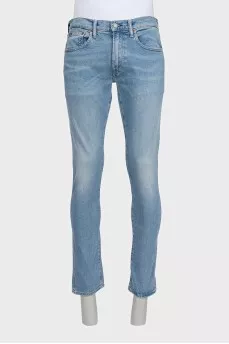 Men's light blue straight fit jeans with a button