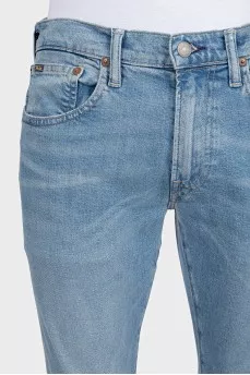 Men's light blue straight fit jeans with a button