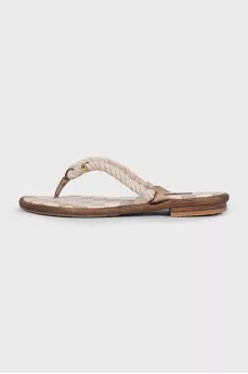 Beige leather flip-flops with a print