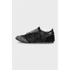 Black leather sneakers with decor