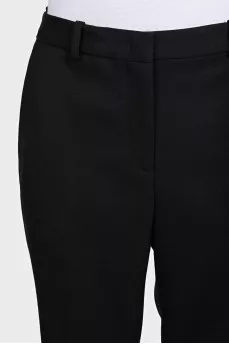 Black high-waisted wide-leg trousers with creases