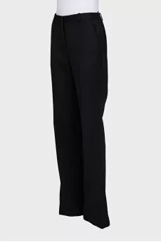 Black high-waisted wide-leg trousers with creases