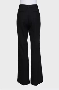 Black high-waisted wide-leg trousers with creases