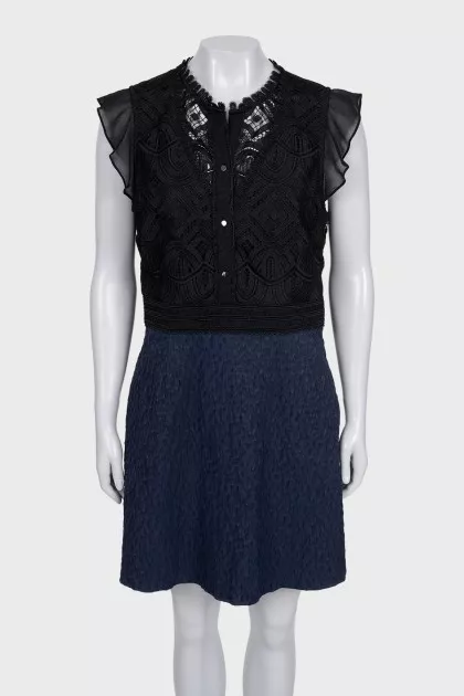 The blue and black dress is decorated with lace
