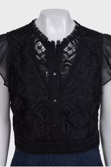 The blue and black dress is decorated with lace