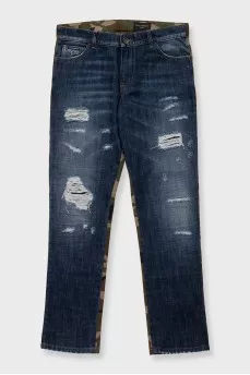 Men's blue ripped jeans with a military print