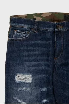 Men's blue ripped jeans with a military print