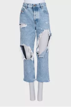 Blue distressed jeans with frayed edges