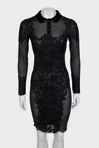 A transparent black dress decorated with lace