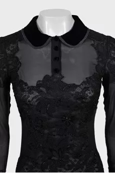A transparent black dress decorated with lace
