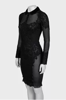 A transparent black dress decorated with lace